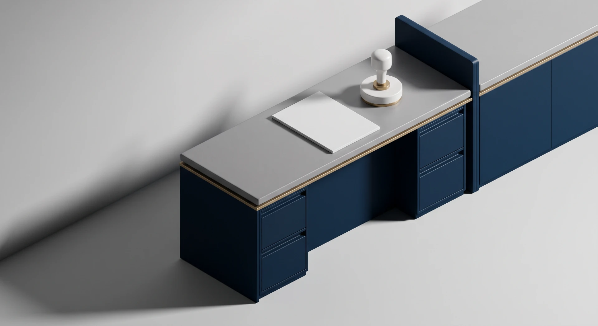 Escritório com mesa de apoio azul e cinza, com puxadores embutidos, bancada longa e um caderno branco sobre a superfície, em estilo moderno e minimalista.
