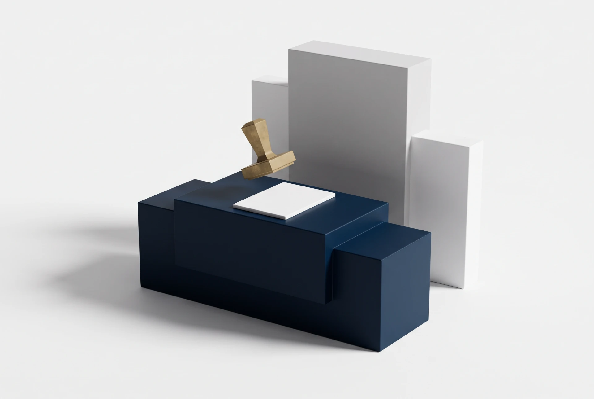 Caixa de presente azul-marinho com tampa e base, detalhe em papel dourado em formato de laço, ao lado de caixas retangulares cinza e branca em fundo claro.